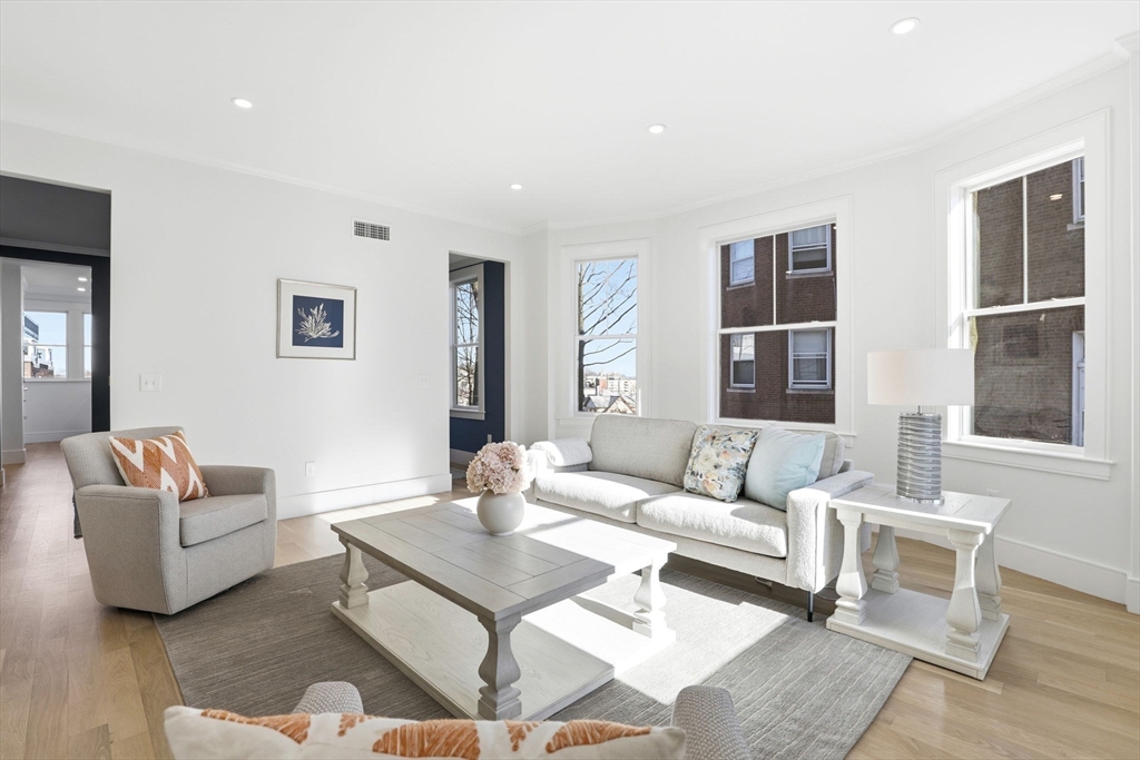 90 Addington Road, Unit 1 Brookline, MA 02445 - Photo 8 of 24 a living room with furniture and a large window