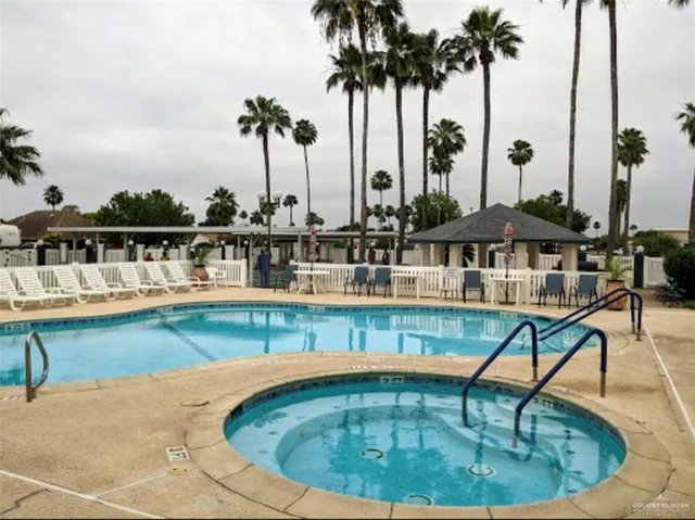 a view of a swimming pool with a lounge chair