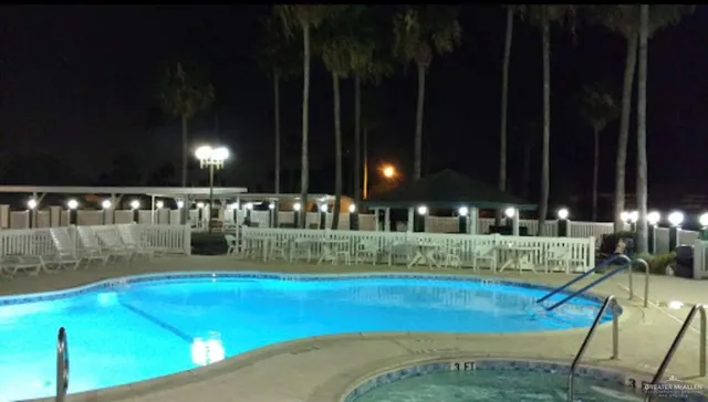 a view of swimming pool with outdoor seating and yard