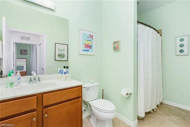 a bathroom with a sink toilet and vanity