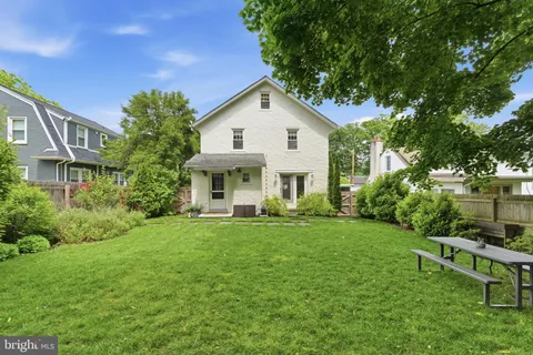 a view of a house with a yard porch and sitting area