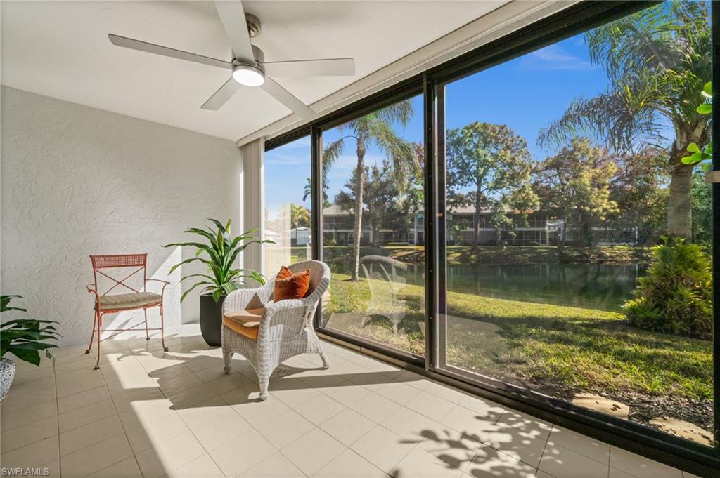 500 Misty Pines Circle, Unit 2103 Naples, FL 34105 - Photo 14 of 38 a swimming pool with outdoor seating and plants