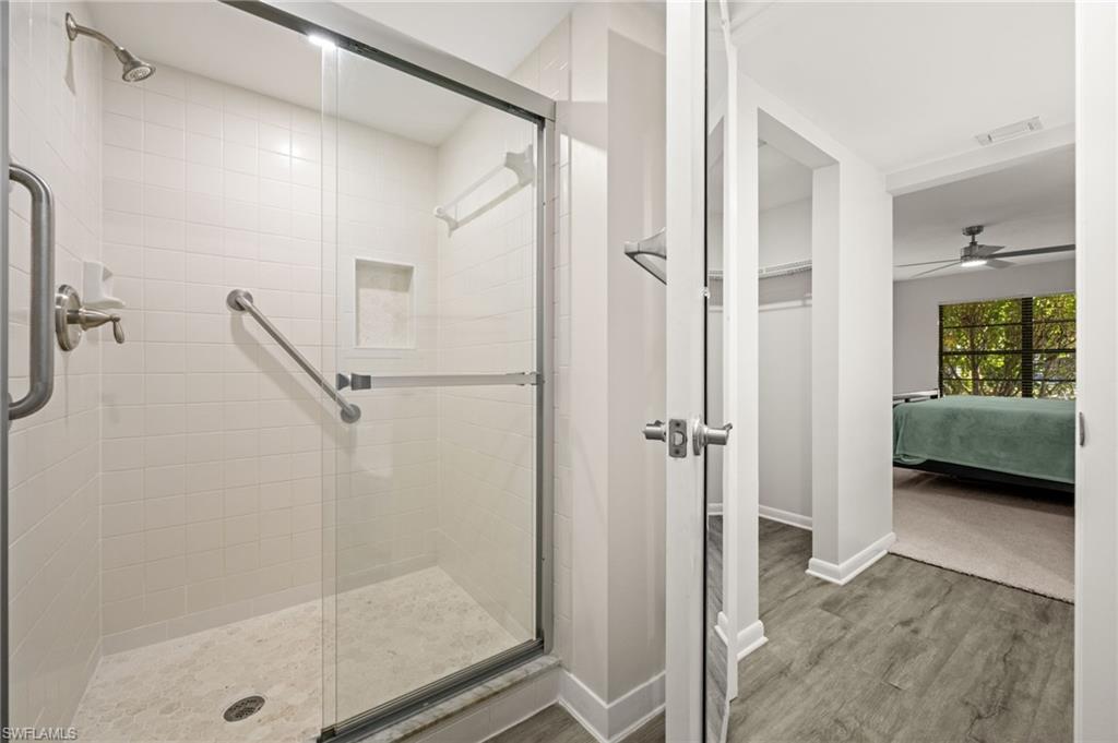 500 Misty Pines Circle, Unit 2103 Naples, FL 34105 - Photo 19 of 38 a view of a walk in closet