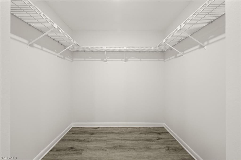 500 Misty Pines Circle, Unit 2103 Naples, FL 34105 - Photo 20 of 38 a view of a room with wooden floor