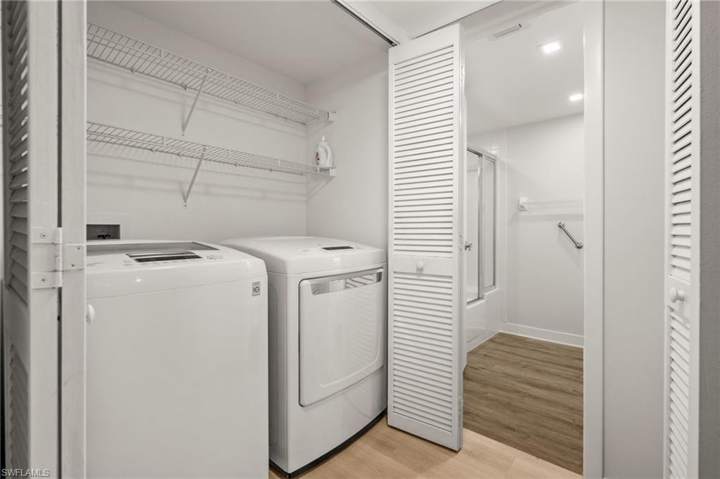 500 Misty Pines Circle, Unit 2103 Naples, FL 34105 - Photo 22 of 38 a view of storage and utility room with washer and dryer