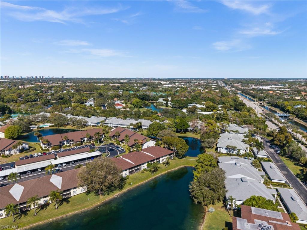 500 Misty Pines Circle, Unit 2103 Naples, FL 34105 - Photo 31 of 38 an aerial view of residential houses with outdoor space