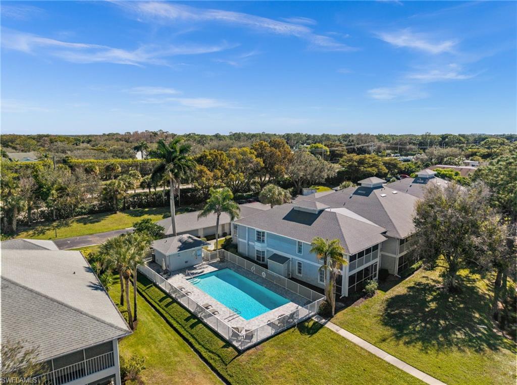 500 Misty Pines Circle, Unit 2103 Naples, FL 34105 - Photo 35 of 38 a view of a city from a terrace