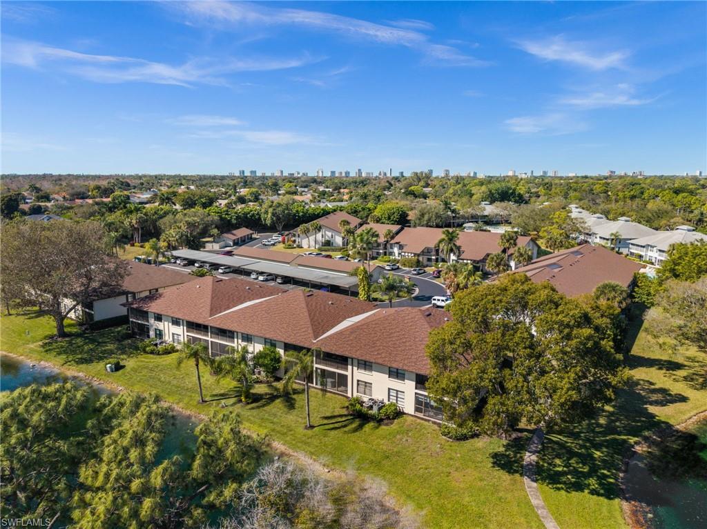 500 Misty Pines Circle, Unit 2103 Naples, FL 34105 - Photo 38 of 38 an aerial view of a houses with a garden