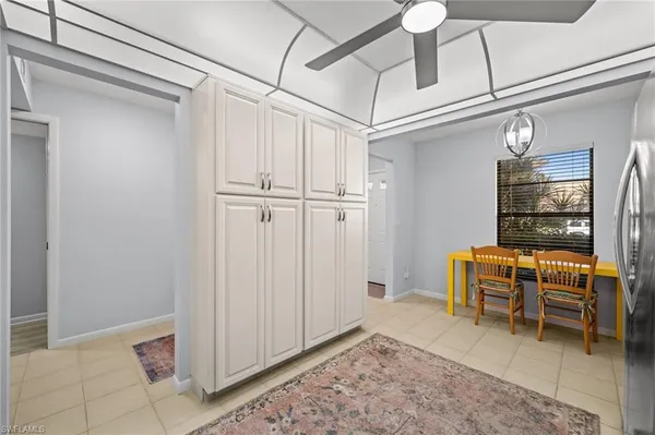 a view of a room with table and chairs