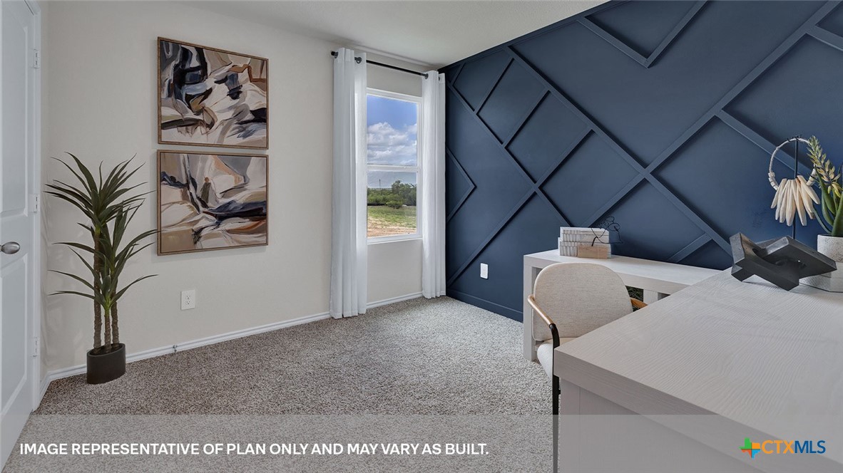 401 Wild Goose Drive Luling, TX 78648 - Photo 13 of 34 a view of a hallway with paintings on the wall