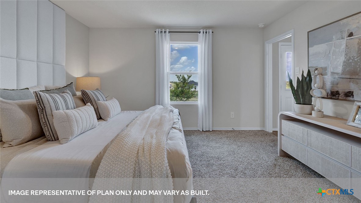 401 Wild Goose Drive Luling, TX 78648 - Photo 25 of 34 a bed room with a bed and a large mirror