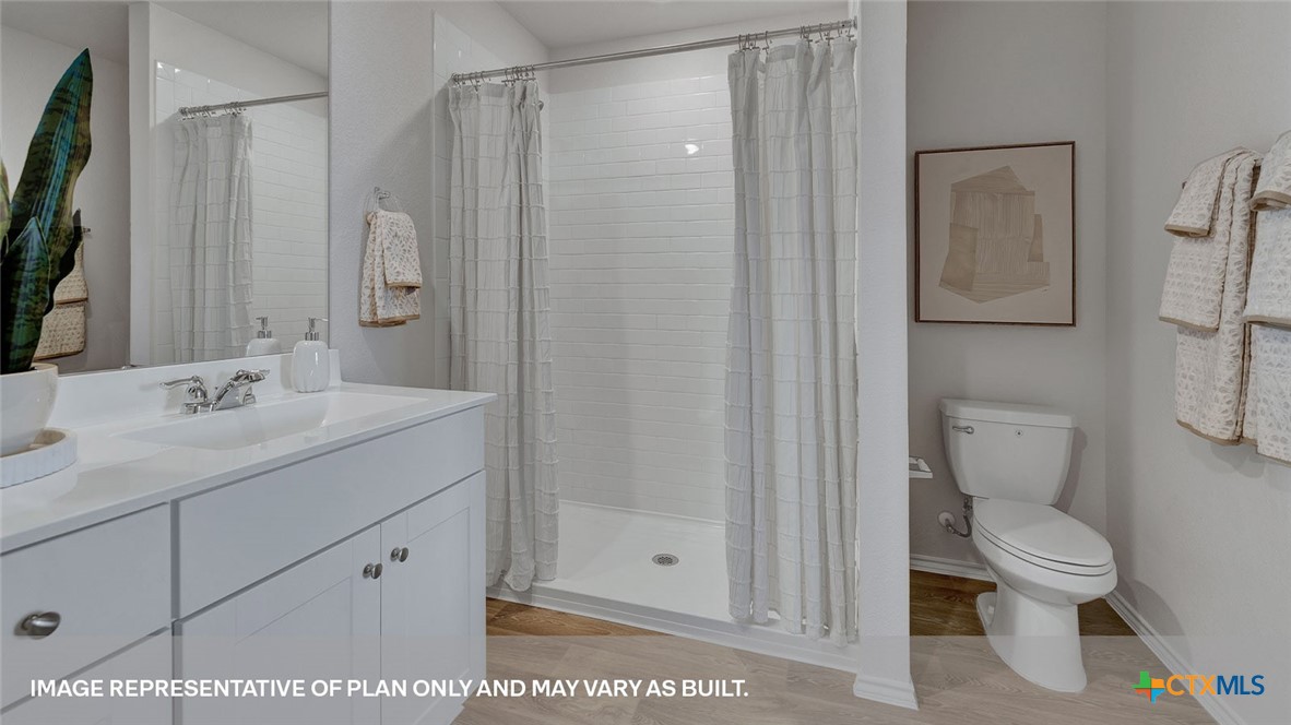 401 Wild Goose Drive Luling, TX 78648 - Photo 26 of 34 a bathroom with a sink a toilet and shower