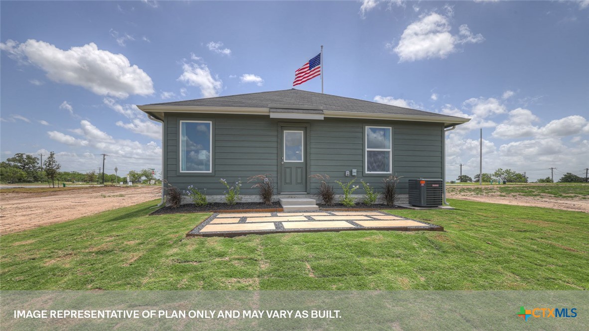 401 Wild Goose Drive Luling, TX 78648 - Photo 30 of 34 a view of a house with backyard and sitting area