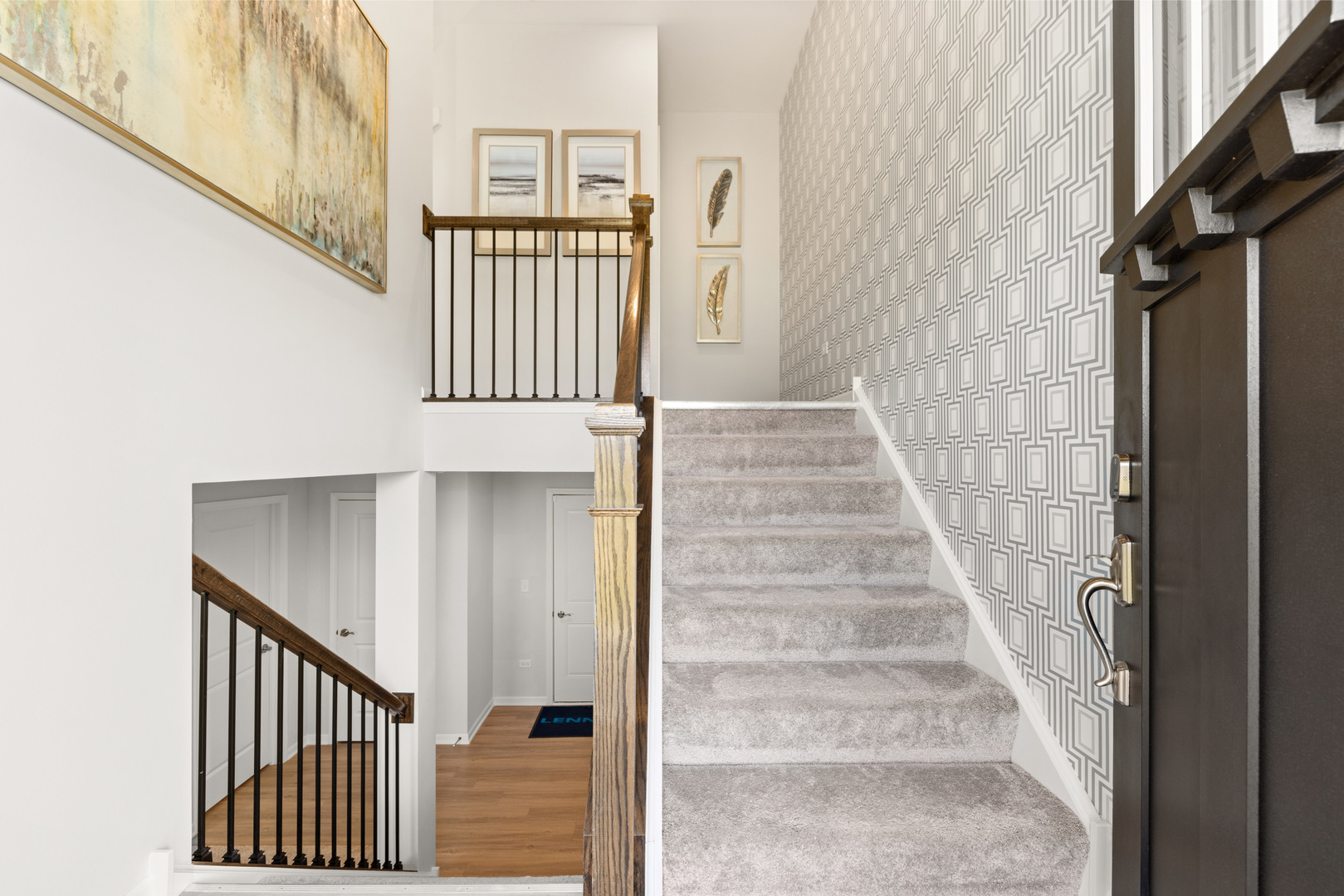 580 Wolverine Drive Aurora, IL 60502 - Photo 15 of 30 a view of staircase with railing and white walls