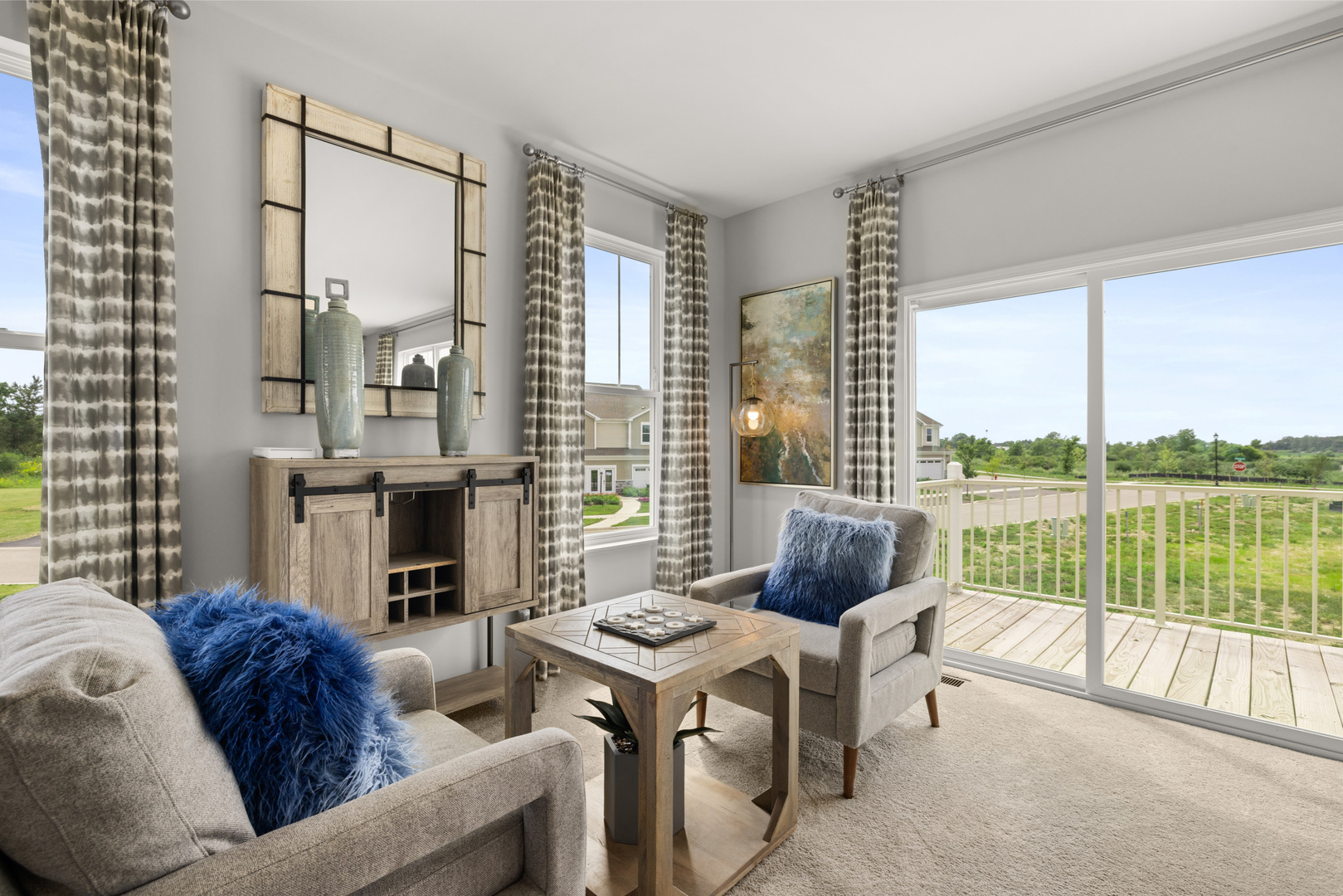 580 Wolverine Drive Aurora, IL 60502 - Photo 9 of 30 a living room with furniture a large window and a fireplace