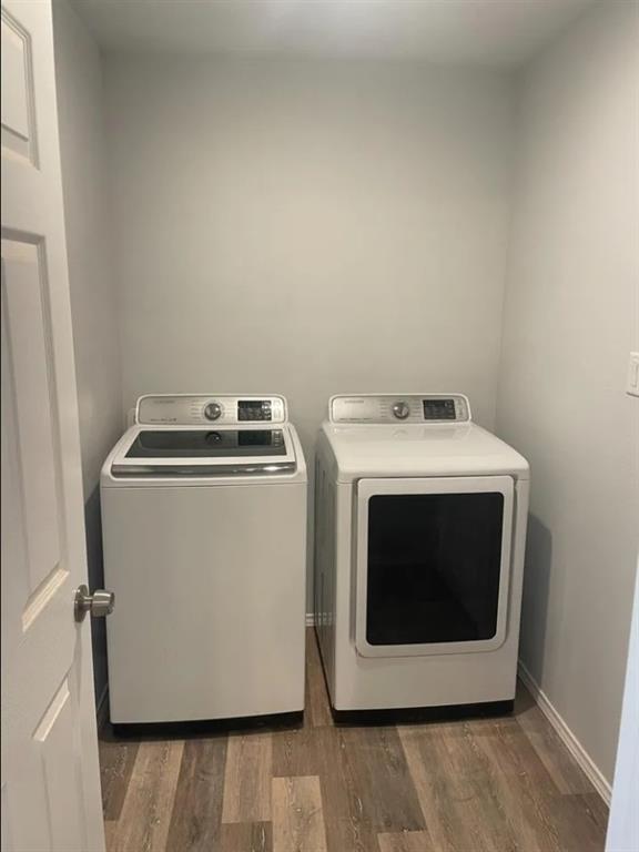 8424 10th Place Lubbock, TX 79416 - Photo 14 of 14 a utility room with dryer and washer