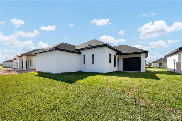 a view of a backyard of the house