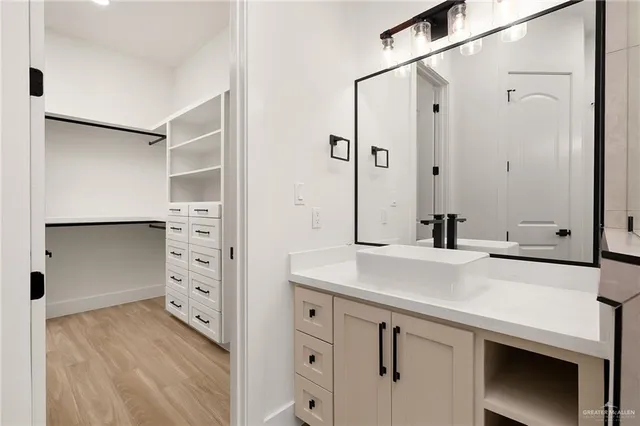 a kitchen with a sink and a refrigerator