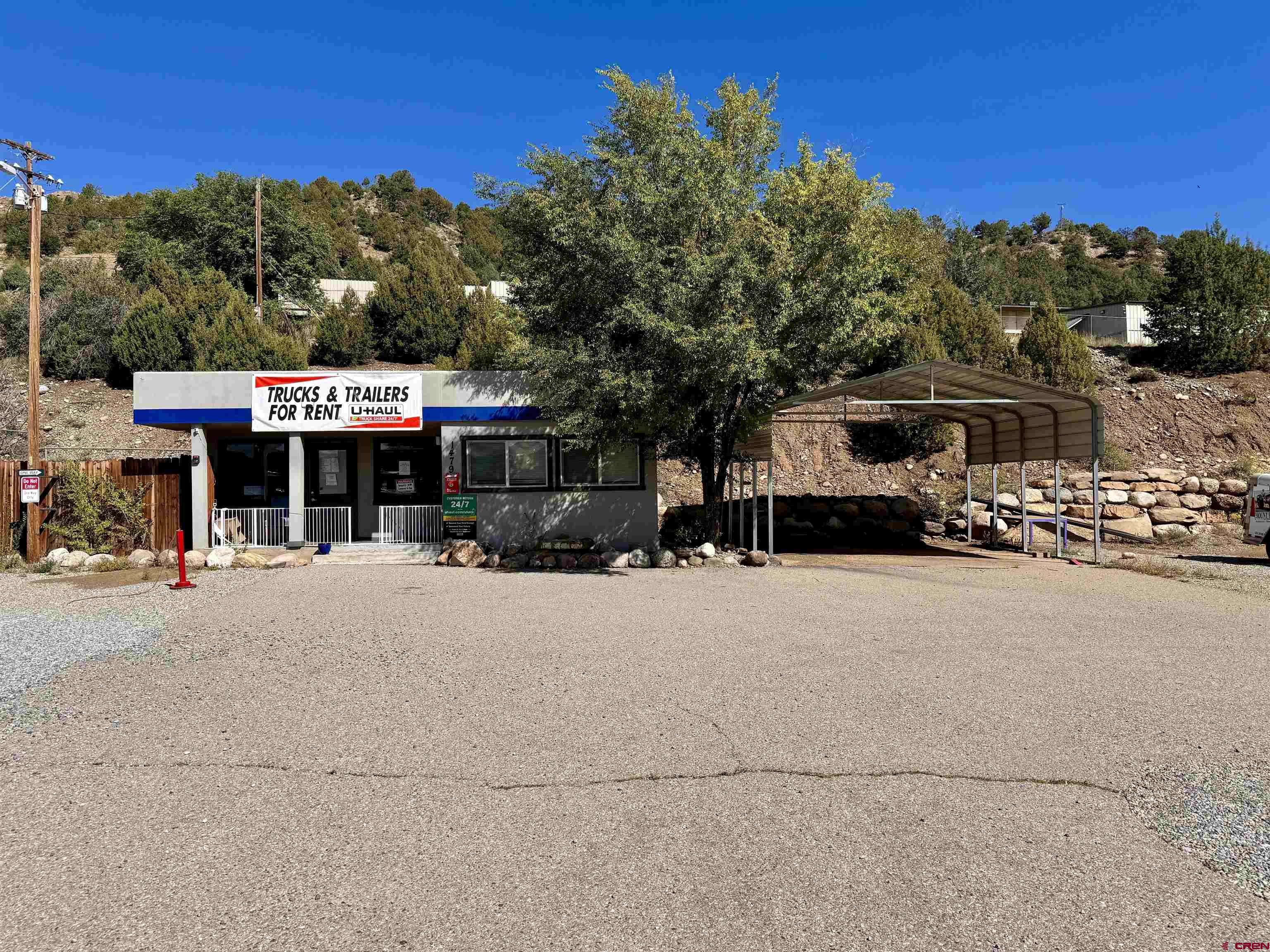 1479 Highway 3 Durango, CO 81301 - Photo 3 of 19 a front view of a house with a yard and parking