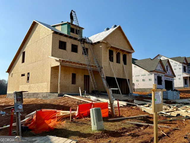 a backyard of a house with seating space