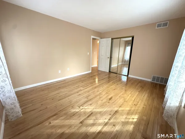 a view of an empty room and window