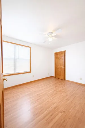 an empty room with a empty space and a window