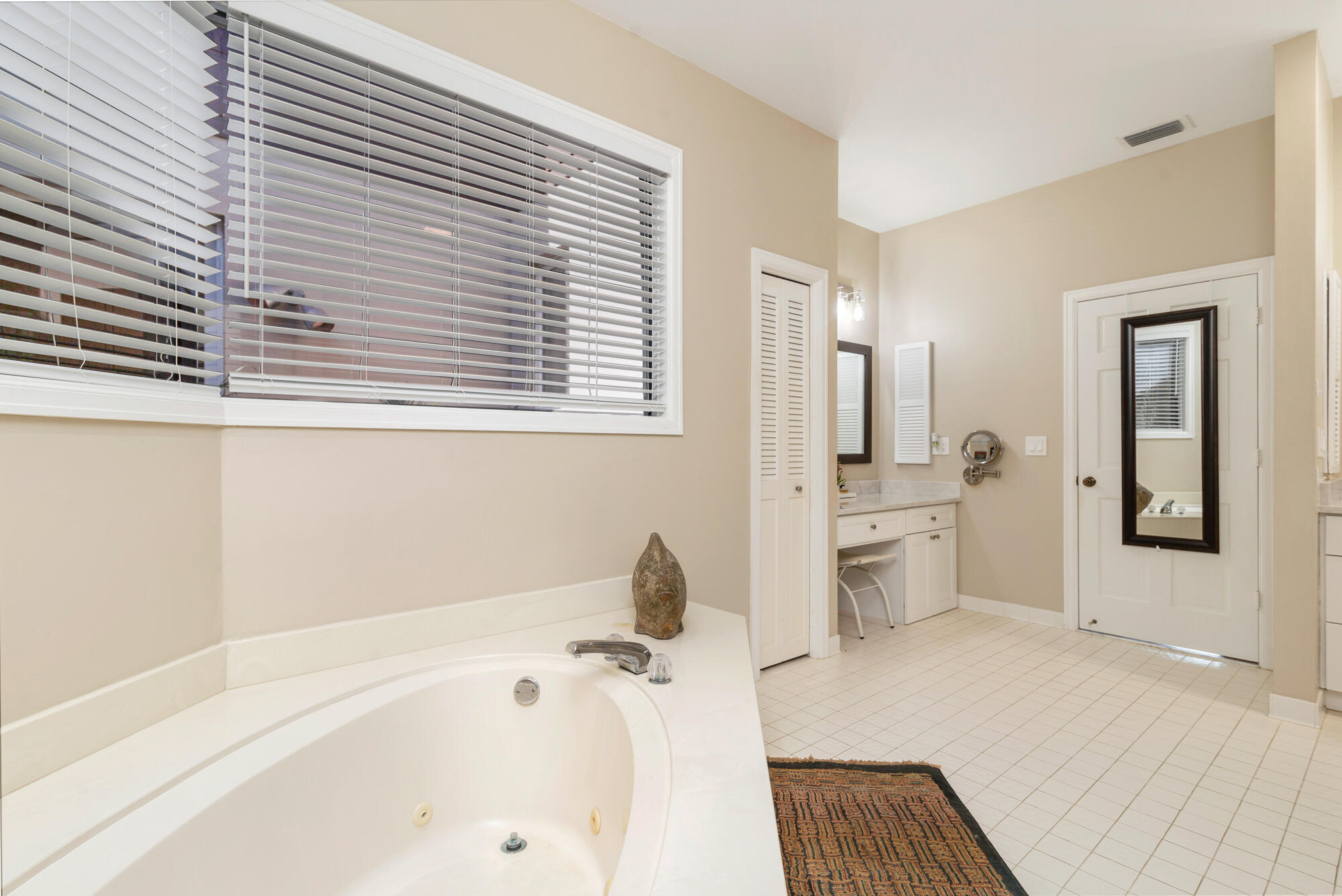 12079 Southeast Birkdale Run Jupiter, FL 33469 - Photo 20 of 50 a bathroom with a bathtub and a sink