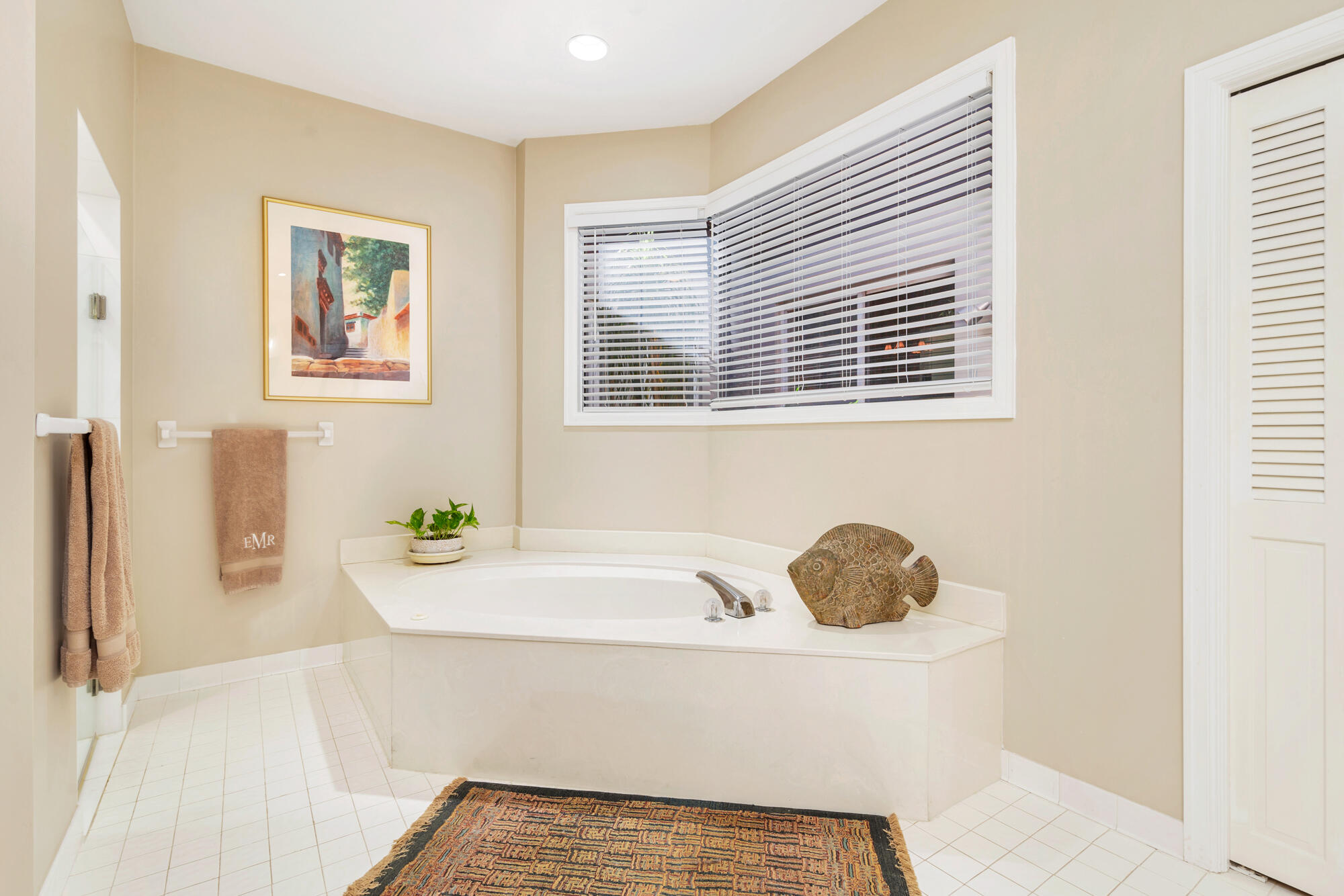 12079 Southeast Birkdale Run Jupiter, FL 33469 - Photo 21 of 50 a bathroom with a tub sink and a window