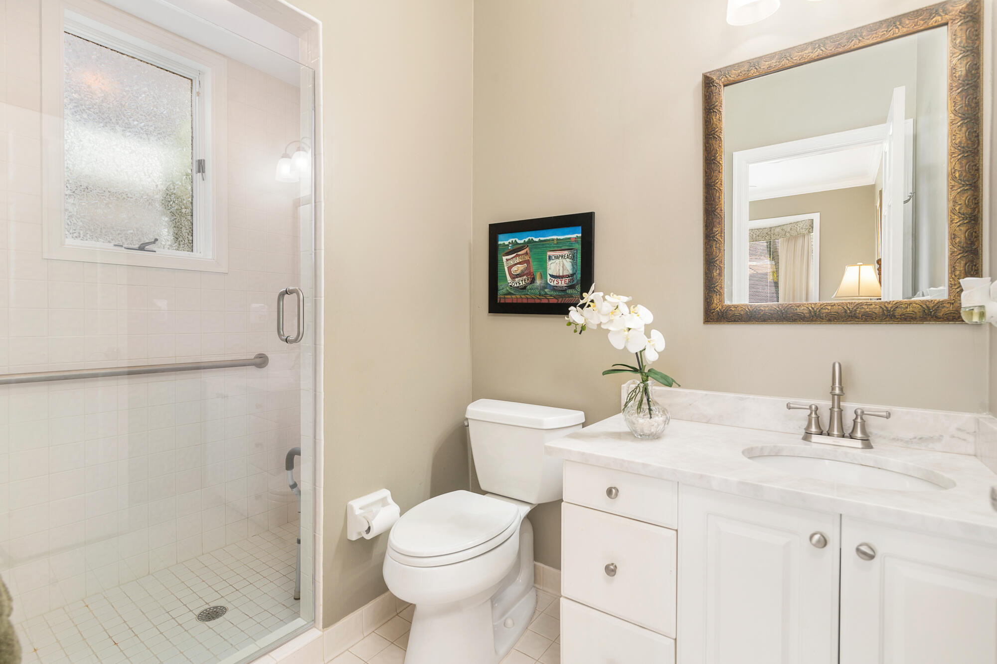 12079 Southeast Birkdale Run Jupiter, FL 33469 - Photo 23 of 50 a bathroom with a sink a toilet and shower