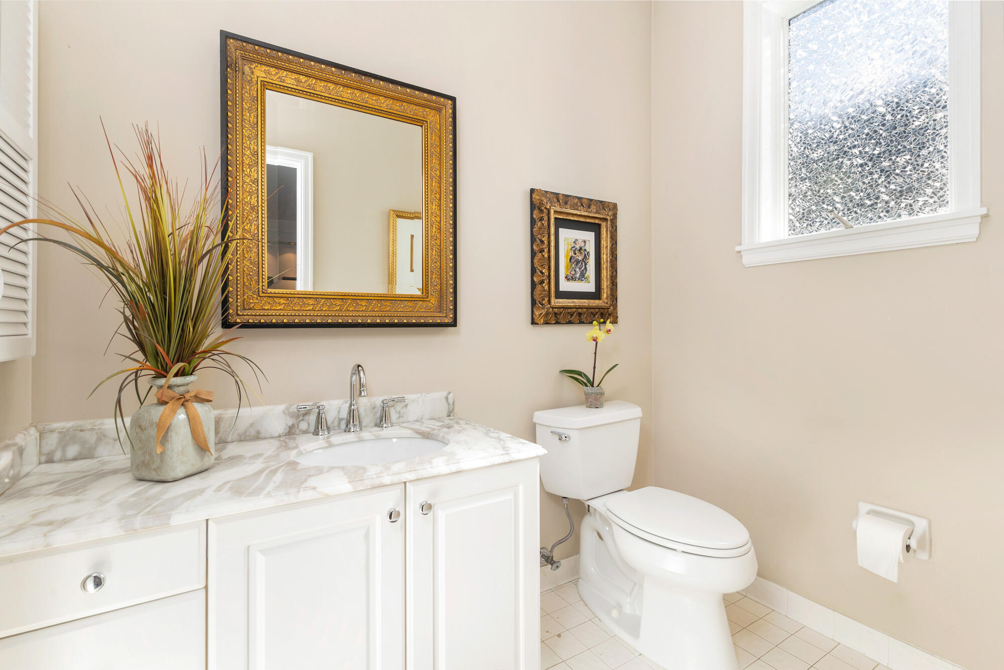 12079 Southeast Birkdale Run Jupiter, FL 33469 - Photo 26 of 50 a bathroom with a toilet a sink a mirror a vanity and next