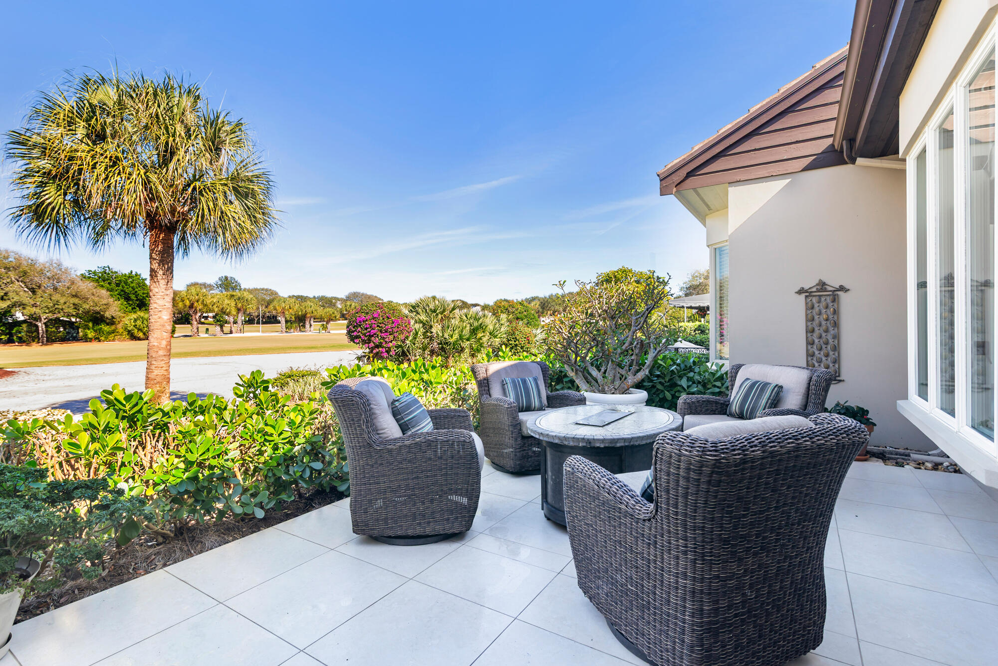 12079 Southeast Birkdale Run Jupiter, FL 33469 - Photo 32 of 50 a view of a patio filled with furniture and a yard