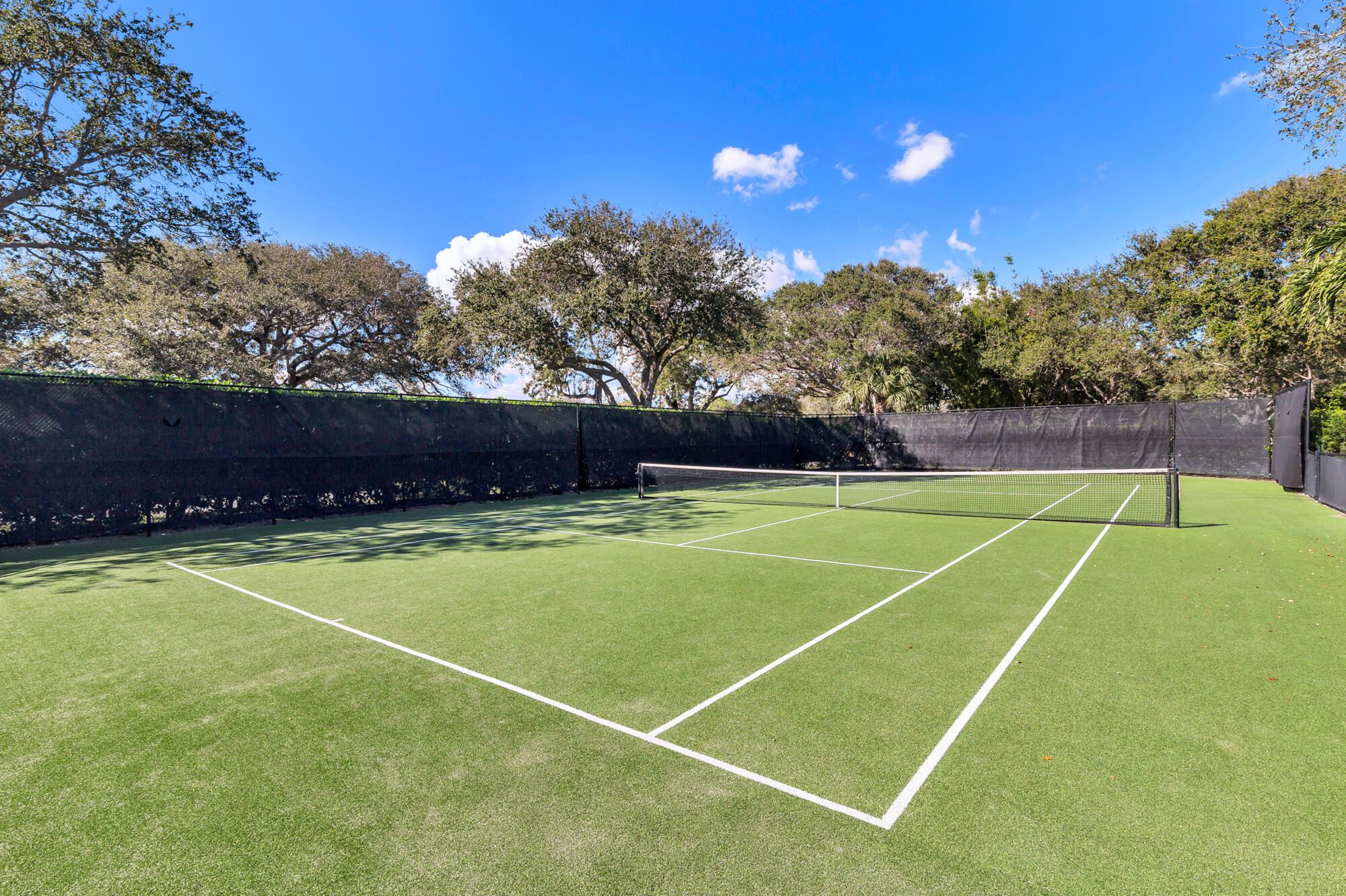 12079 Southeast Birkdale Run Jupiter, FL 33469 - Photo 42 of 50 a view of a tennis court
