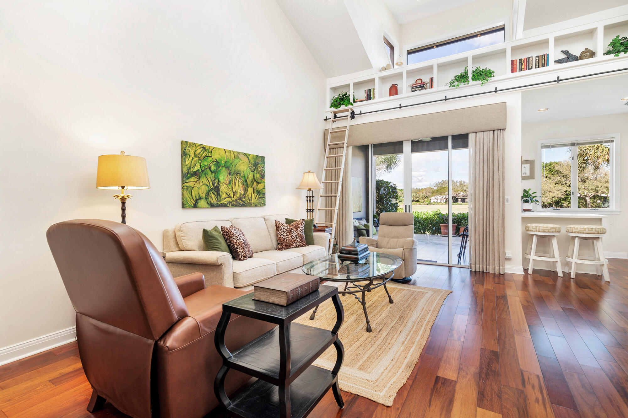 12079 Southeast Birkdale Run Jupiter, FL 33469 - Photo 7 of 50 a living room with furniture and a wooden floor