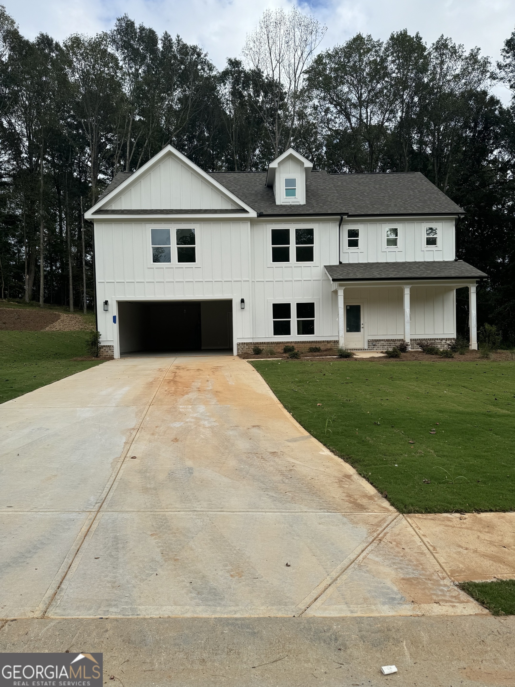 253 Delightful Way, Unit 6 Winder, GA 30680 - Photo 1 of 1 a front view of a house with a garden