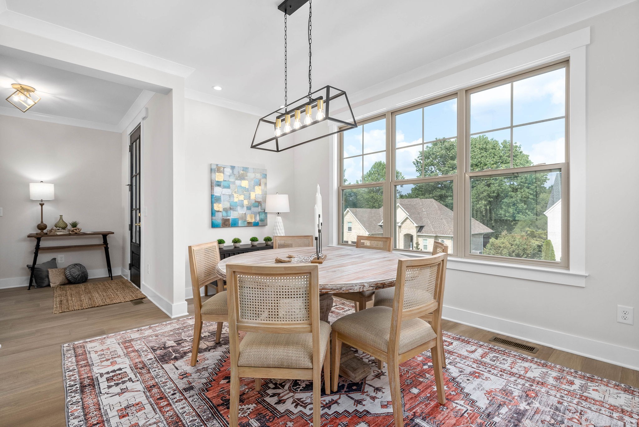 122 Augusta Trail Springfield, TN 37172 - Photo 15 of 51 a dining room with wooden floor a chandelier a wooden table and chairs