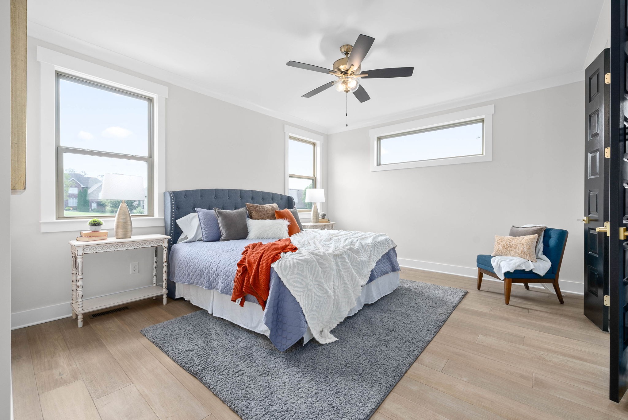 122 Augusta Trail Springfield, TN 37172 - Photo 18 of 51 a bedroom with a bed and a chandelier