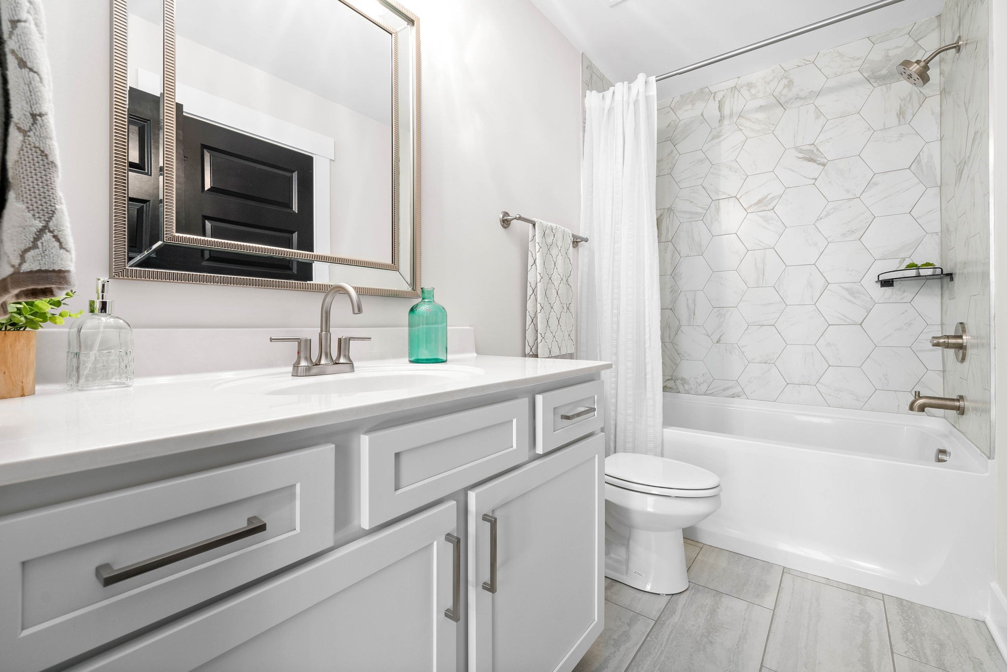 122 Augusta Trail Springfield, TN 37172 - Photo 28 of 51 a bathroom with a sink a toilet a mirror and shower