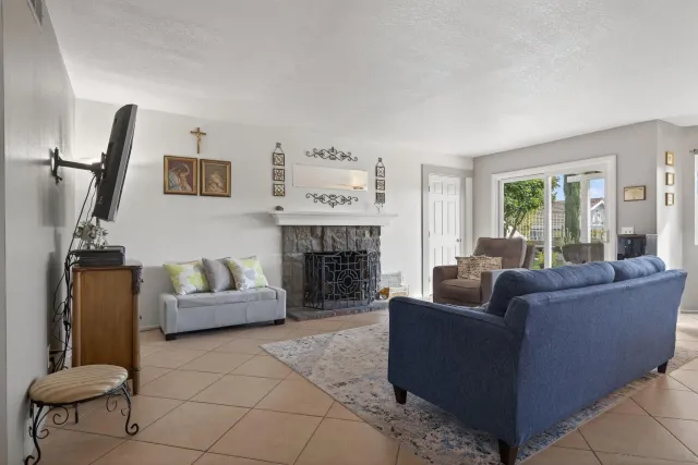 a kitchen with stainless steel appliances granite countertop a stove top oven a sink dishwasher and cabinets with wooden floor