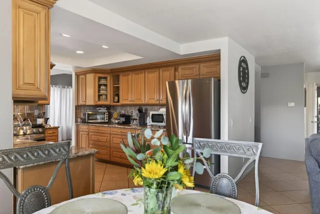 a bedroom with a bed and a large mirror