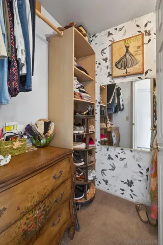a kitchen with a refrigerator and cabinets