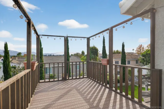 a view of a house with backyard sitting area and garden