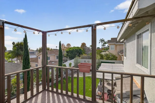 a view of a patio with table and chairs and potted plants