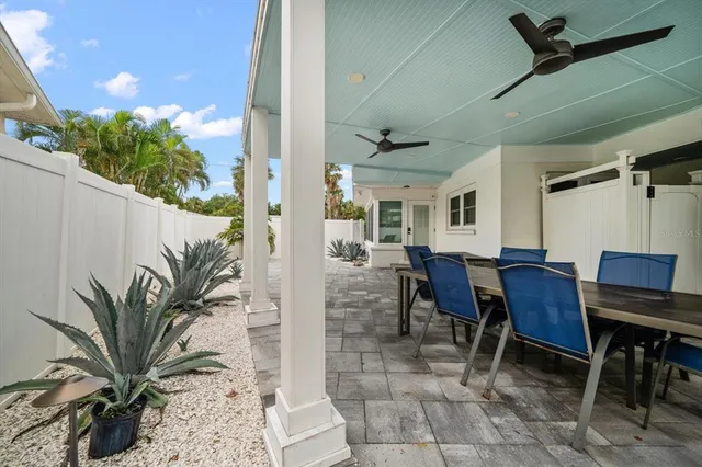 a view of a livingroom with furniture and a potted plant