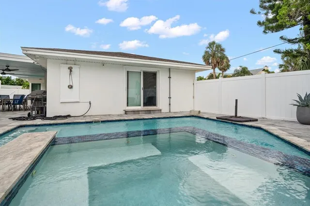 swimming pool view with a outdoor space