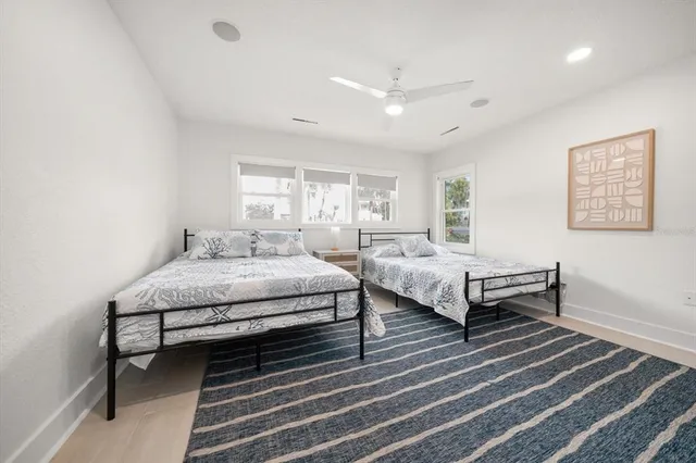 a spacious bedroom with a bed and a table