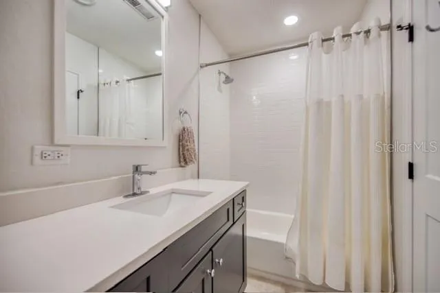 a bathroom with a sink double vanity and a mirror