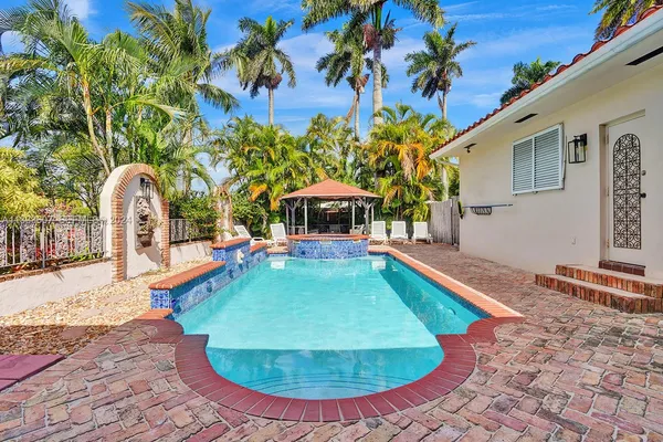 a view of a house with swimming pool