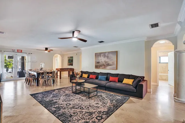 a living room with furniture and a rug