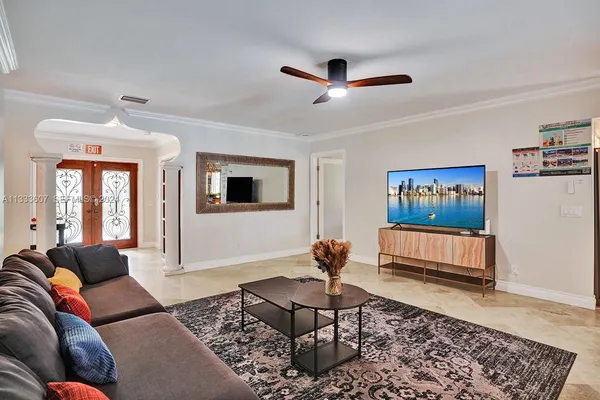 a living room with furniture and a rug