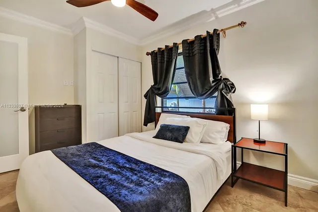 a bedroom with a bed and a closet